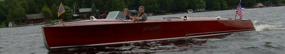 Chris and Diane Gaige in their "Woody Boat"