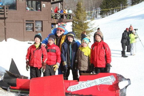 Inlet's Frozen Fire & Lights Fest will feature a cardboard sled race. McCauley hosted a similar event for Winter Carnival last Sunday, where Deke's Flying School was among the entries. Pictured from left are Cedric Barkauskas, Porter Kelly. Deke Morrison, Charlie Uzdavinis, George Uzdavinis & Calvin Barkauskas. 