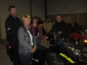 Sandy Booton, co-chair of Snofest, Doug Smith of Smith Marine and Dianna Finnerty amd Nevin Finnerty-with Smith Marine's Ski-doo Summit. Photo by Wende Carr