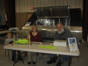 Chase Greene, Kelly Noonan-Greene and Gary Staab sold tickets for the CAA snowmobile trailer raffle. Photo by Wende Carr