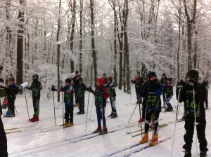 Nolan Fenton #19 and Emily Rudolph #31 at the start of the J4 3km classic race at Bristol Mountain