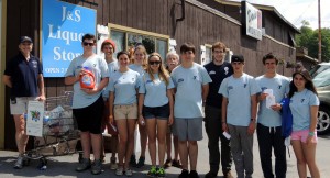 Kiwanis Members Annette Mahoney and Bob Stanton along with Counselors in Training from YMCA Camp Gorham collected foot items at Dan's Market in Eagle Bay. Courtesy photo.