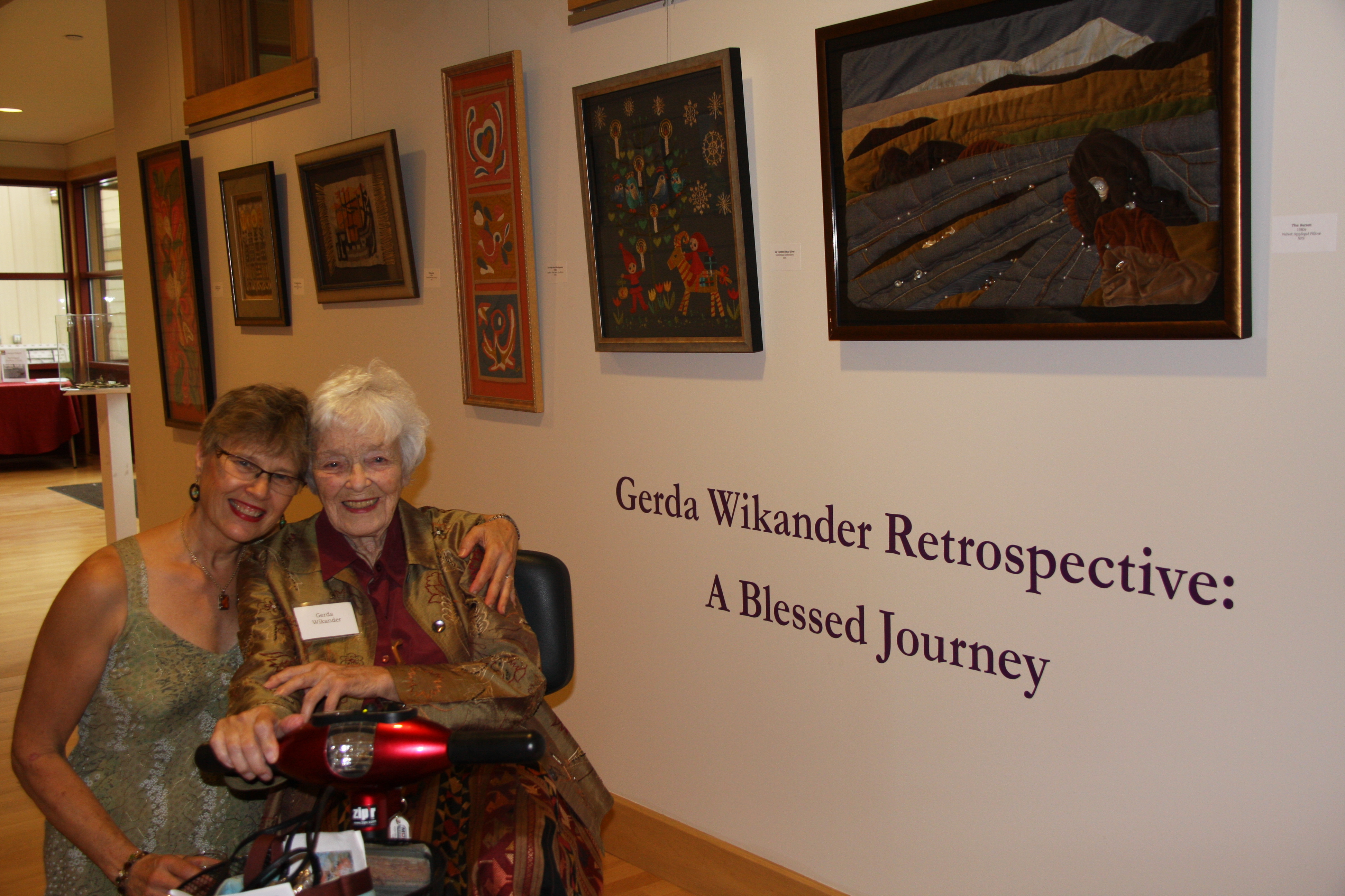 Artist Greda Wikander (right), 99 years old, has been represented in the Central Adirondack Art Show for 62 years. The show is hostd locally by View. A retrospective of her work is being featured to coincide with this year's exhibit. Pictured with Gerda is her daughter Kristine.