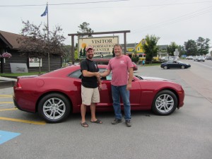 Don Haehl presenting the keys to the 2014 Chevy Camero to winner Tim Kuhn of Marcy, NY. He meant to buy a ticket last year, but they sold out before he could. He and his wife had a miscommunication and thought each other bought one. He said, "I wasn't meant to win it last year." He only bought one ticket this year. 