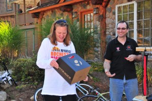 Pedals & Petals co-owner Ted Christodaro awards a raffle prize. 