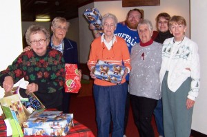 A group of Niccolls church volunteers prepares for the Operation Christmas Child project. From left are Ruth Brussel, Jean Kull, Jean Gaudin, Jeremy Dreja, Char Pylman, Ellen Dreja, and Ginny Milton. 