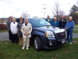 2013 GMC Terrain – from left, Leslie Beauchamp, Treasurer, TOW Health Center Fund, Inc.; Carolyn Trimbach, Treasurer, CAP-21; Sandra Booton, Branch Manager, Adirondack Bank; Ruth Brussel, Secretary, CTS; Fred Trimbach, Treasurer CTS; Al Brussel, Transportation Coordinator, CTS; Mike Ross, Board Member, Health Center Fund; Ray Schoeberlein, President, CTS Board. 