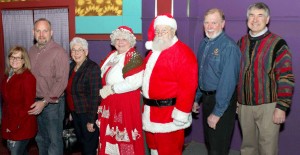 Shown, from left, are Alyssa, Duane and Loretta Thayer, Mrs. Claus, Santa, Kiwanis President and event Co-Chair Mike Griffin and Christmas for Kids Project Chair and Past Kiwanis President Chris Gaige. Courtesy photo