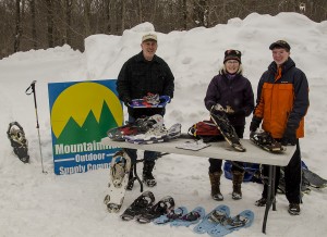 Snowshoes ready for loan to participants... Kiwanis members Fred Trimbach, Nanette Shovea-Burke and volunteer Andrew Trimbach. 