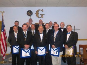 Officers for North Woods Lodge officers installed were: Back row: RW Timothy Harwood-Trustee, W. Albert Brussel-Treasurer, Br. Thomas Beckingham-SMC, Thomas Smedley-Chaplain, W Stephen Park-Secretary, Br. Kent Carnel (partially hidden) Steward, Br. Edmund Girtler-Tiler. Front row: Br. William Hollister-Musician, Br. Wayne Beckingham-SW, Br. Larry Ventura-JD, WM Carl Klossner, Tory Dunn-SD, Theodore Riehle Jr-JW, and RW Andrew Getty-Trustee three years, 2014-2017. 