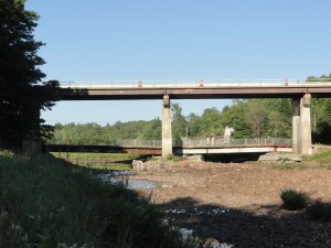 This view of the McKeever Bridge repair project was taken from the riverfront of McKeever resident Gail Murray’s yard on Tuesday, July 29th. She reported that jack-hammering begins around 6:30 a.m. and continues close to 3:30 p.m. during the week. She noted that the river was higher that morning due to the heavy rains the previous day. Photo by Gail Murray