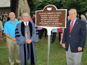 Steve Schanely, president of the Chapel board of trustees, Rev. Dr. Richard McCaughey, minister, and Richard Williams, Chapel historian stand next to the new marker on the day of the unveiling. 