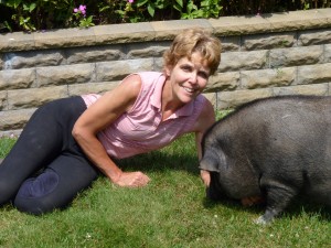Anne Phinney and Fiona, her pot-bellied pig.  Photo by Michele deCamp