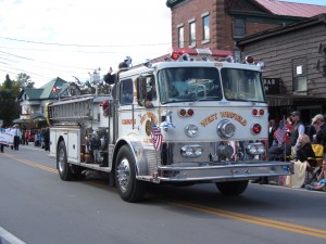 A West Winfield Fire Department vehicle paraded through downtown Old Forge during last year’s Fire Fighter’s Drill School. File photo by Gina Greco