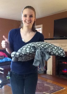 Kelsey Simpson holds one of her handmade Dog Beds