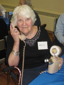 Nancy Gibson with  a 1950’s telephone