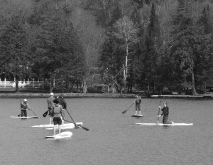 Mountainman staff gives Stand Up Paddle  instruction during an Old Forge Pond clinic.