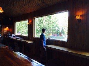 Pat Duffy looking out the new windows behind the bar overlooking Big Moose Lake and his future.
