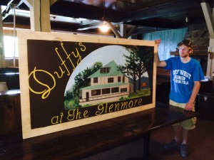 Pat Duffy examines the new Glenmore sign made by his aunt Ingrid VanSlyke.
