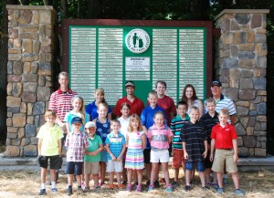 Kids T Off scholarship winners: back row, Thendara Club Pro Rich Chapman, Nicole Redpath, Daniel Stefanko, Tommy Cooper, Melissa Murphy and TOW Varsity Golf Coach Louie Ehrensbeck with the July children’s golf camp participants