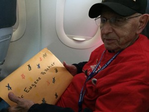 Gene Pelletier receives his Mail Call package on the plane