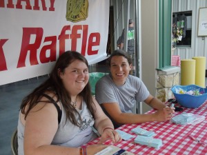 Montana Burrell, left, and Celeste Smith sold last-minute raffle tickets at the Steak Bake.