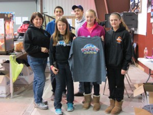 Diane Amos and some Kiwanis Key Club volunteers helped sell the 2015 Snodeo shirts