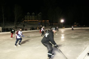 Pond Hockey with Wood Hotel in the background