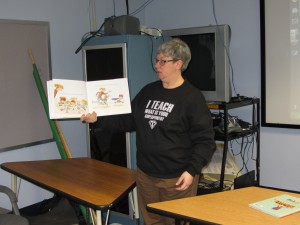 Judy Ehrensbeck reads a superhero book to the PARP participants